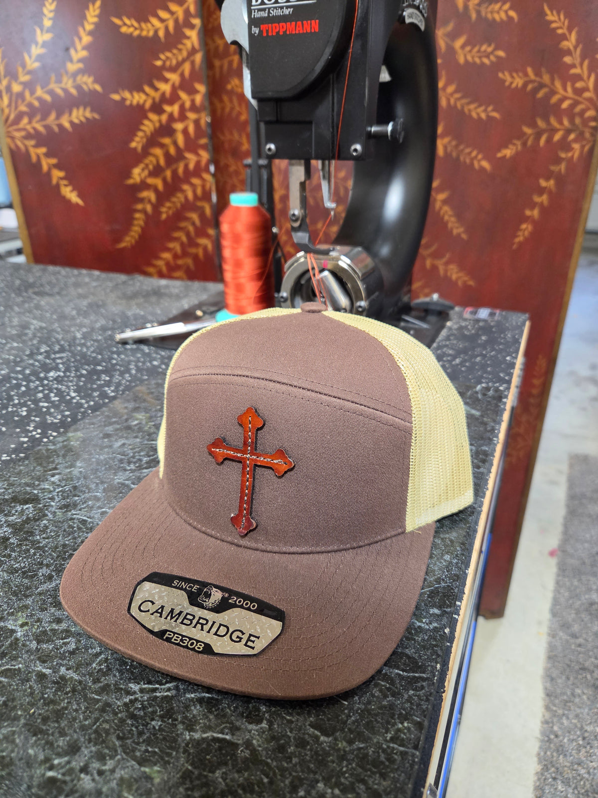 7 Panel Trucker Hat w Cross Leather Patch